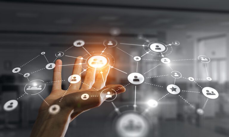 A hand reaching out to interact with digital icons representing social connections and networks.